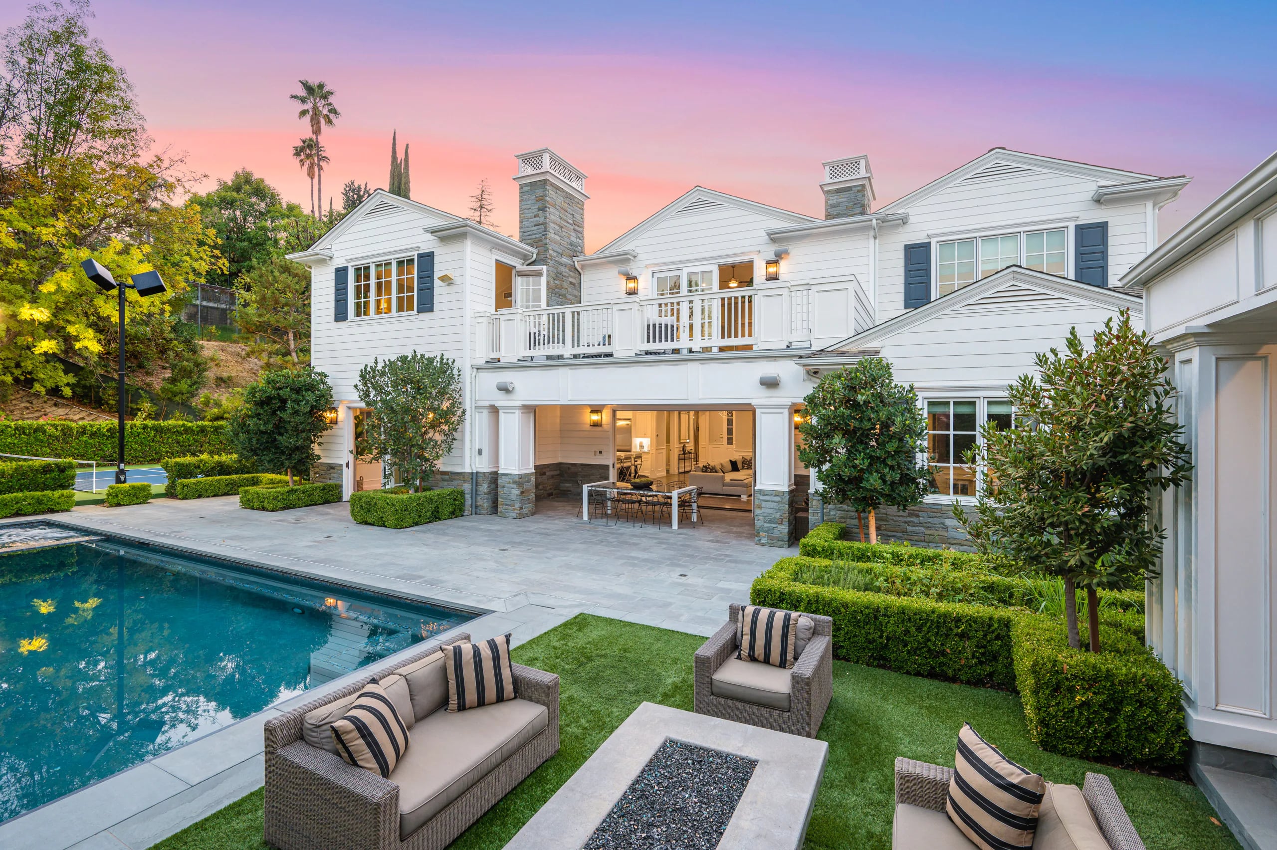 Luxury estate with a pool at sunset